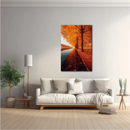 Sofá claro en un salón moderno, con una pintura de árboles naranjas y un río.