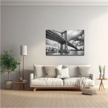 Puente de Manhattan con fondo urbano, en escala de grises, sobre un sofá claro en una sala.