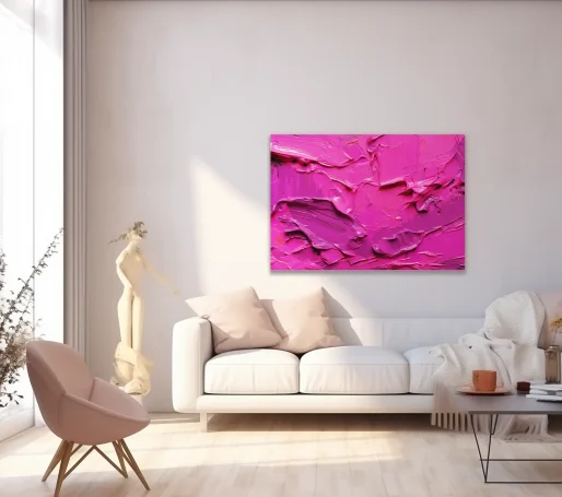 Pared con cuadro abstracto rosa y sala luminosa con sofá y figura decorativa.