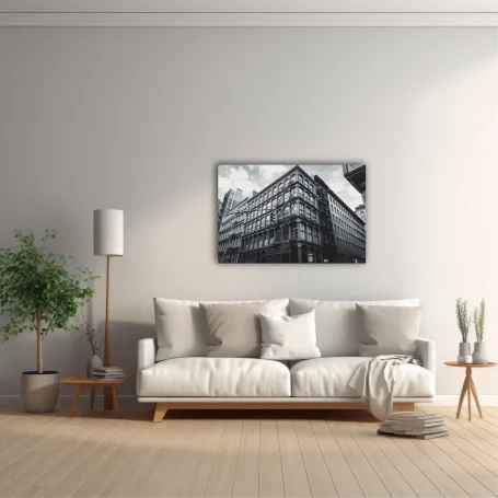 Sala moderna con un sofá blanco, lámpara de pie, planta y una fotografía en la pared.